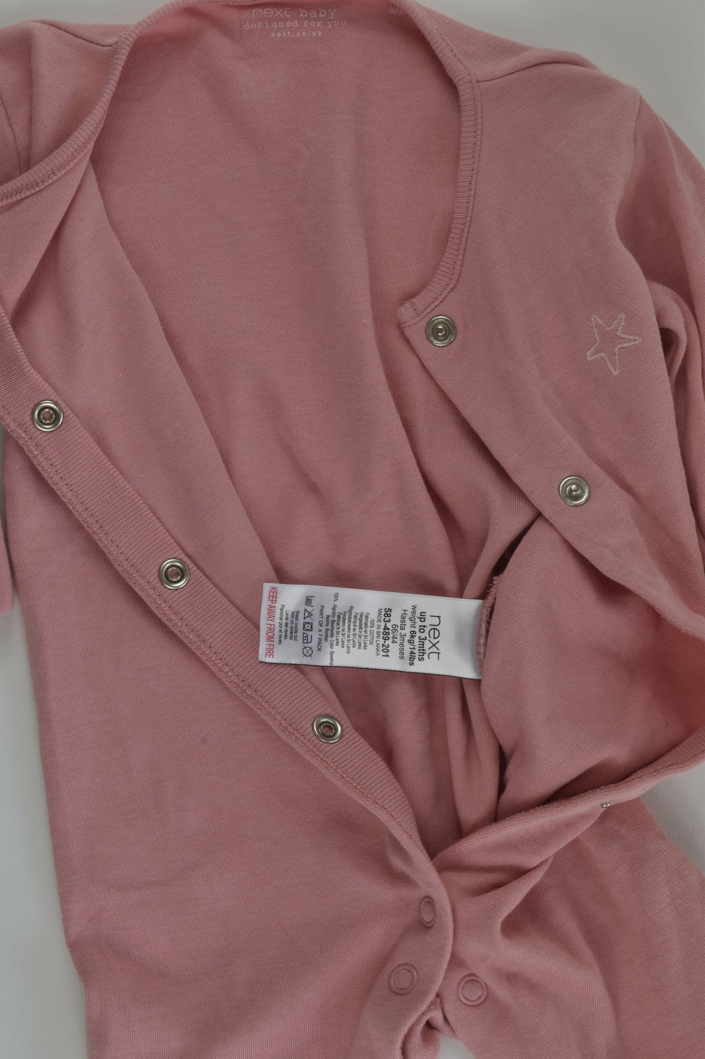 Next Size 000 Footed Romper