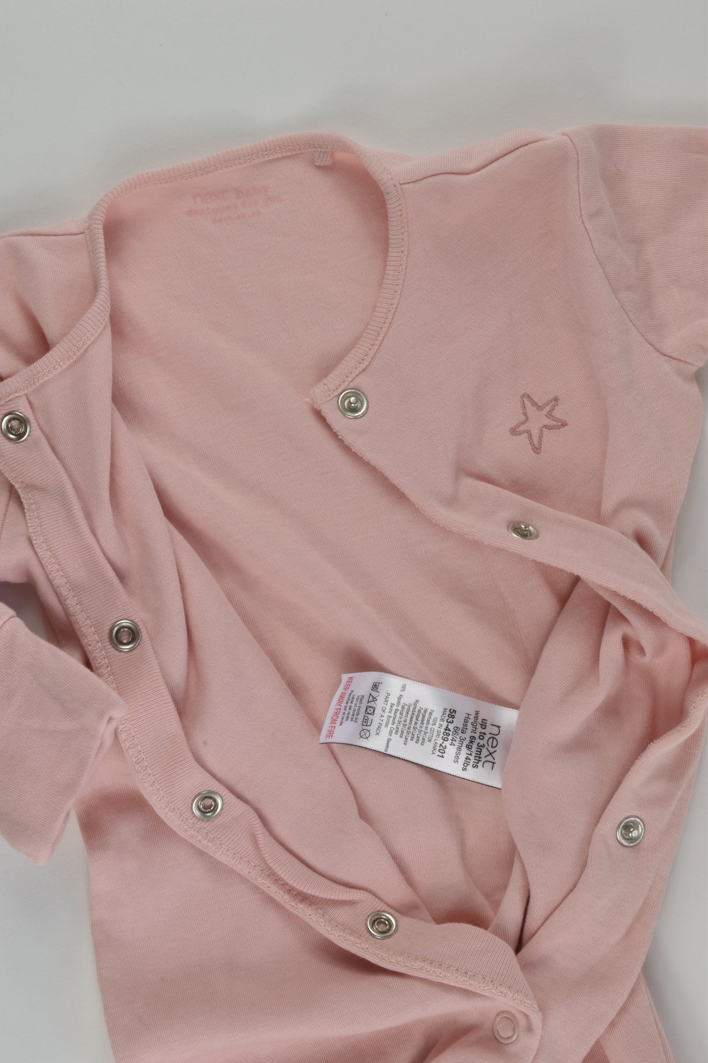 Next Size 000 Footed Romper
