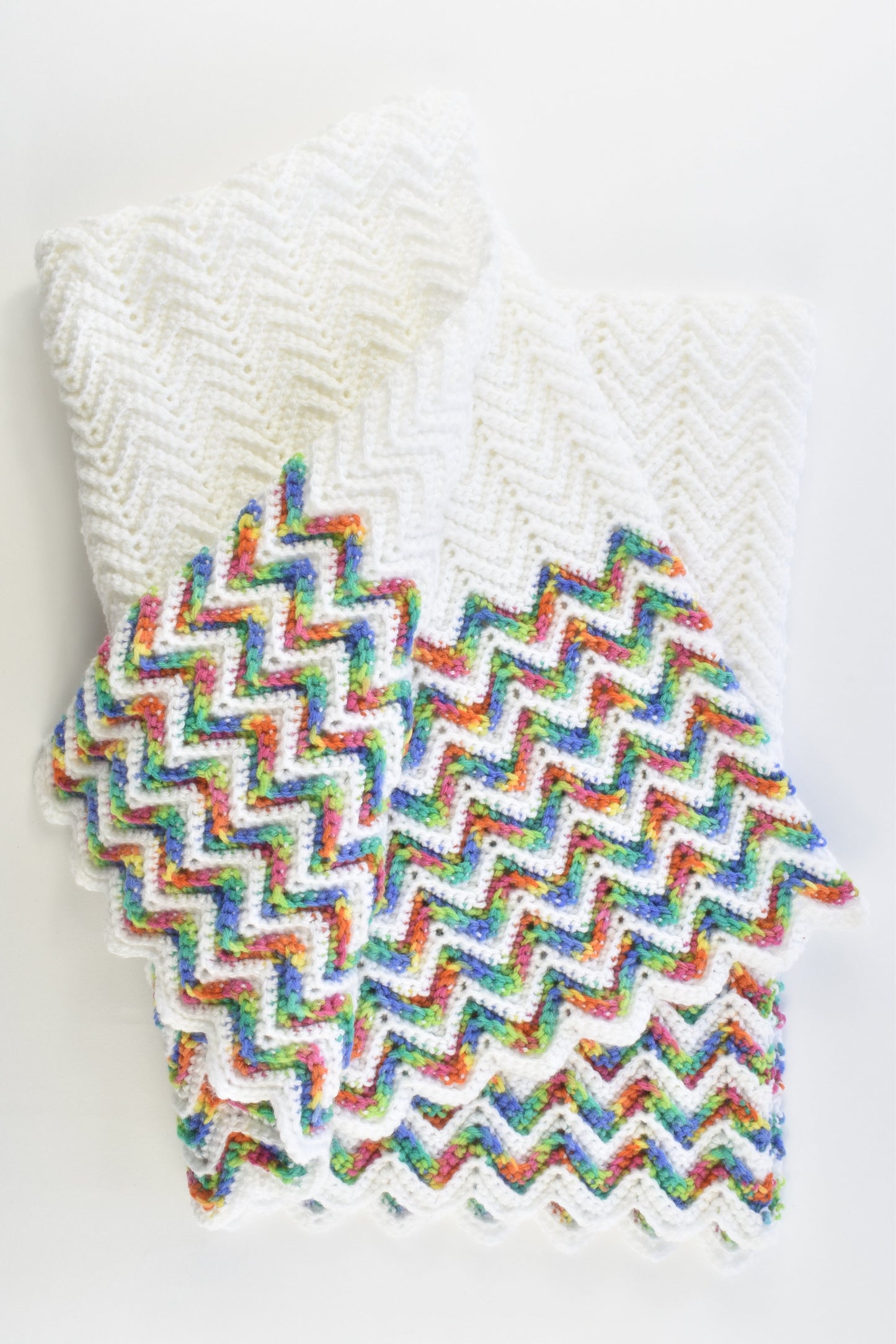 Handmade Knitted White Baby Blanket with Rainbow Zig Zags
