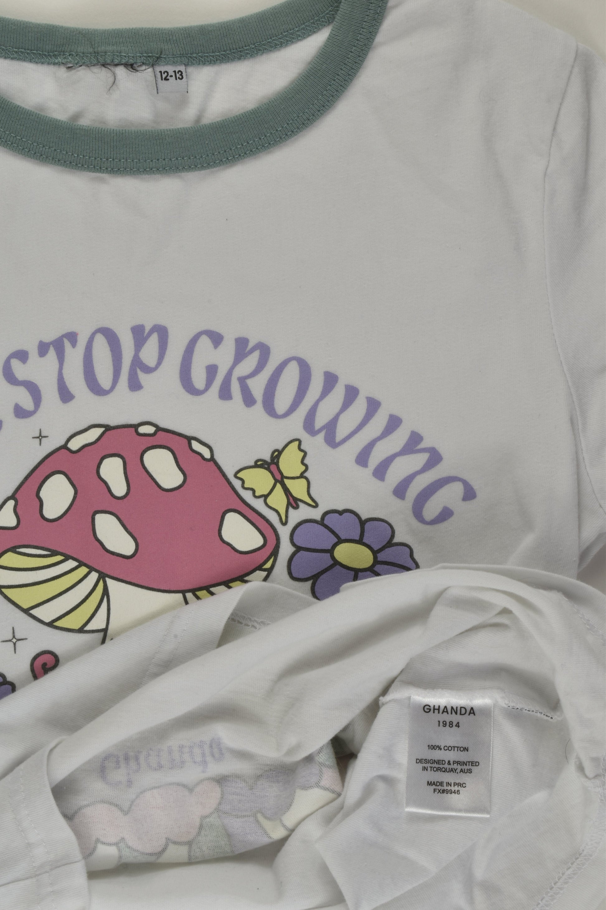 Ghanda Size 12-13 'Never Stop Growing" T-shirt