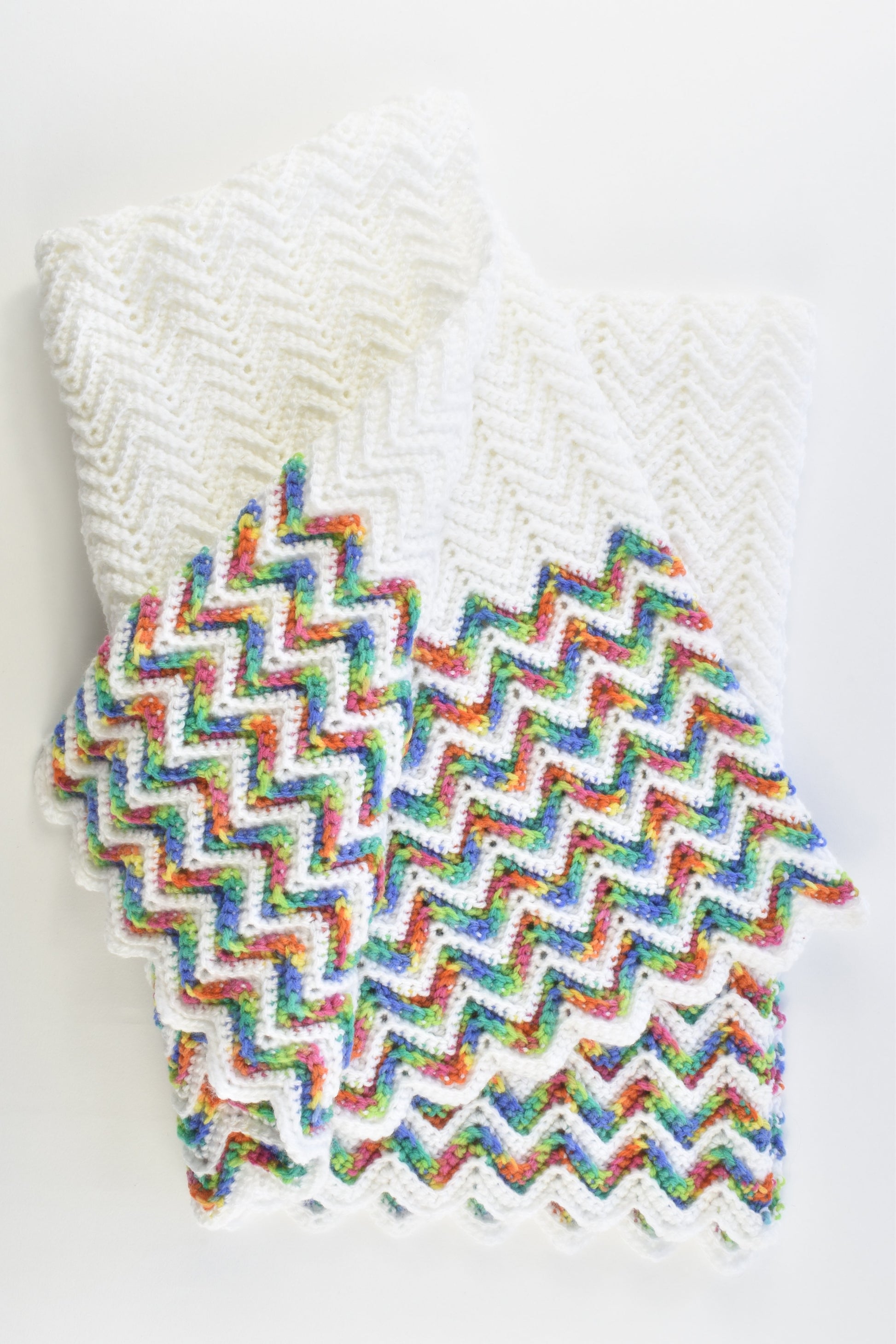 Handmade Knitted White Baby Blanket with Rainbow Zig Zags