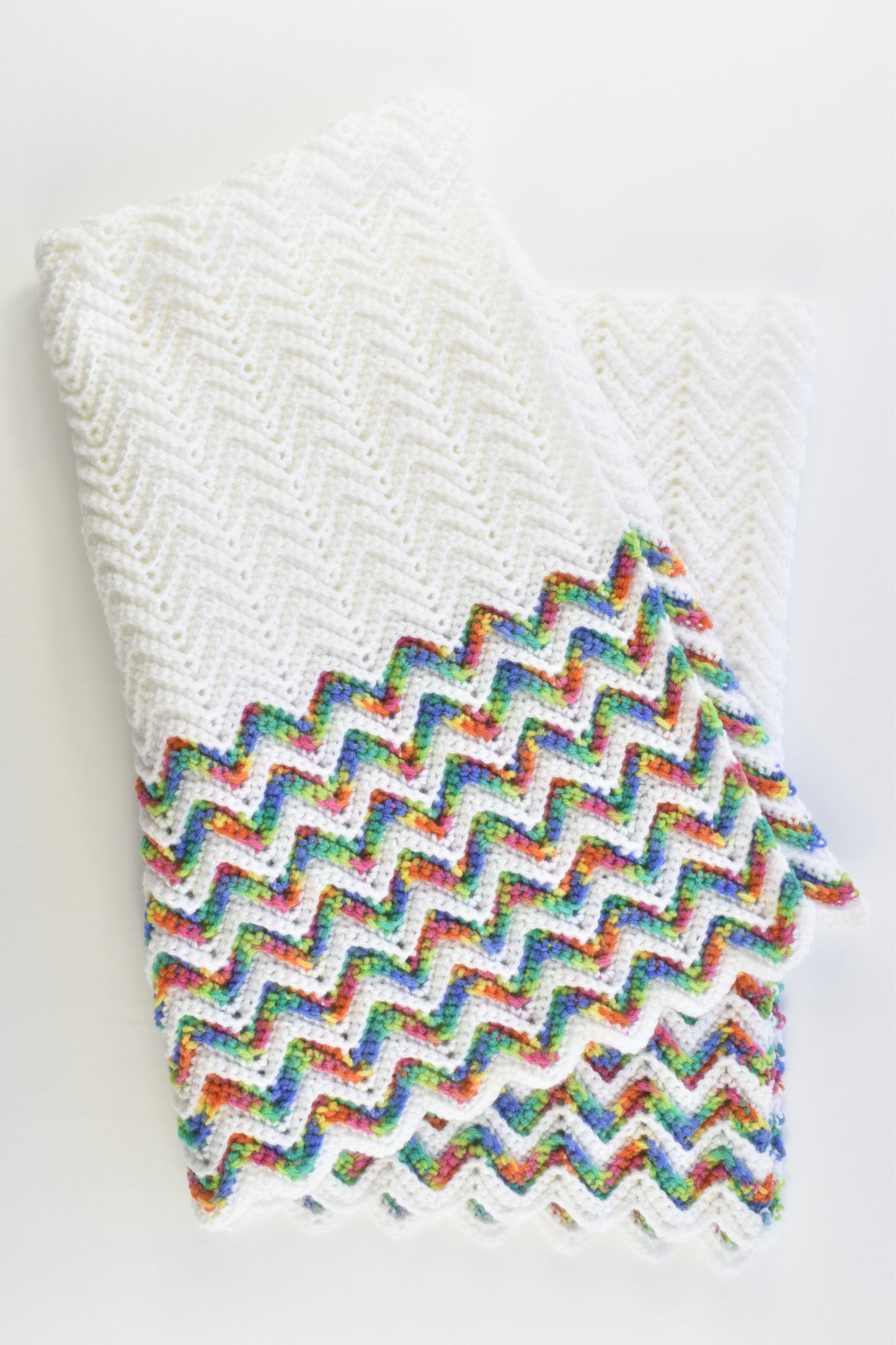 Handmade Knitted White Baby Blanket with Rainbow Zig Zags
