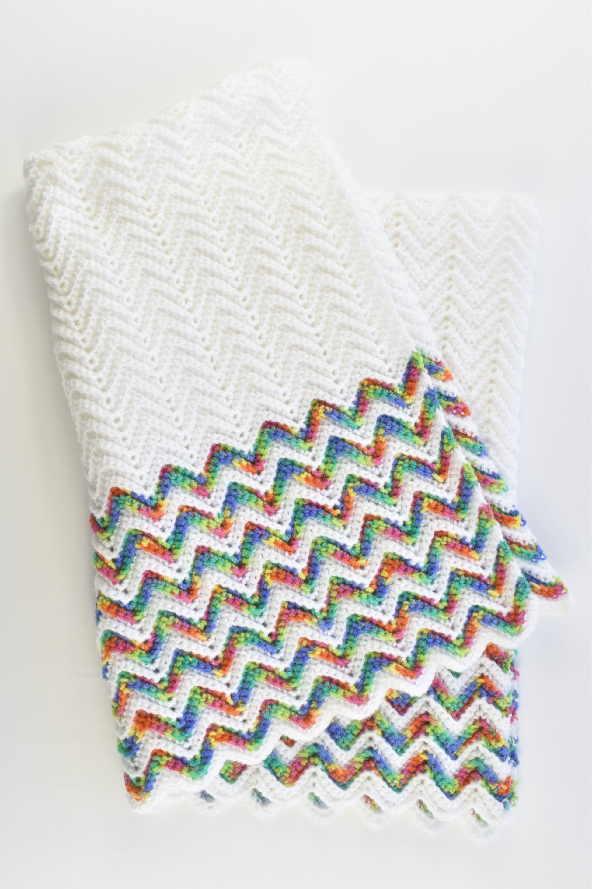 Handmade Knitted White Baby Blanket with Rainbow Zig Zags